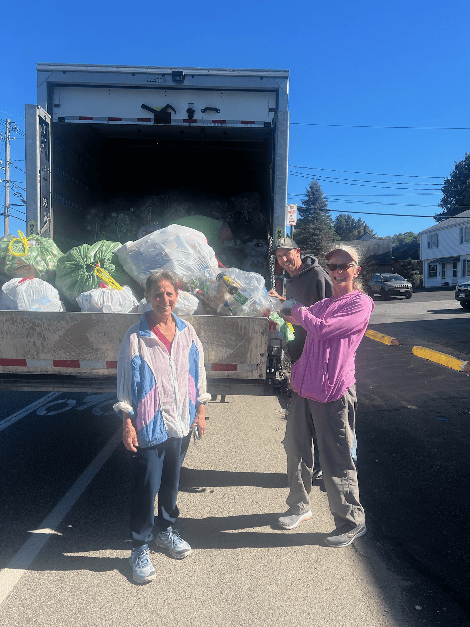 Community members recycling cans and bottles